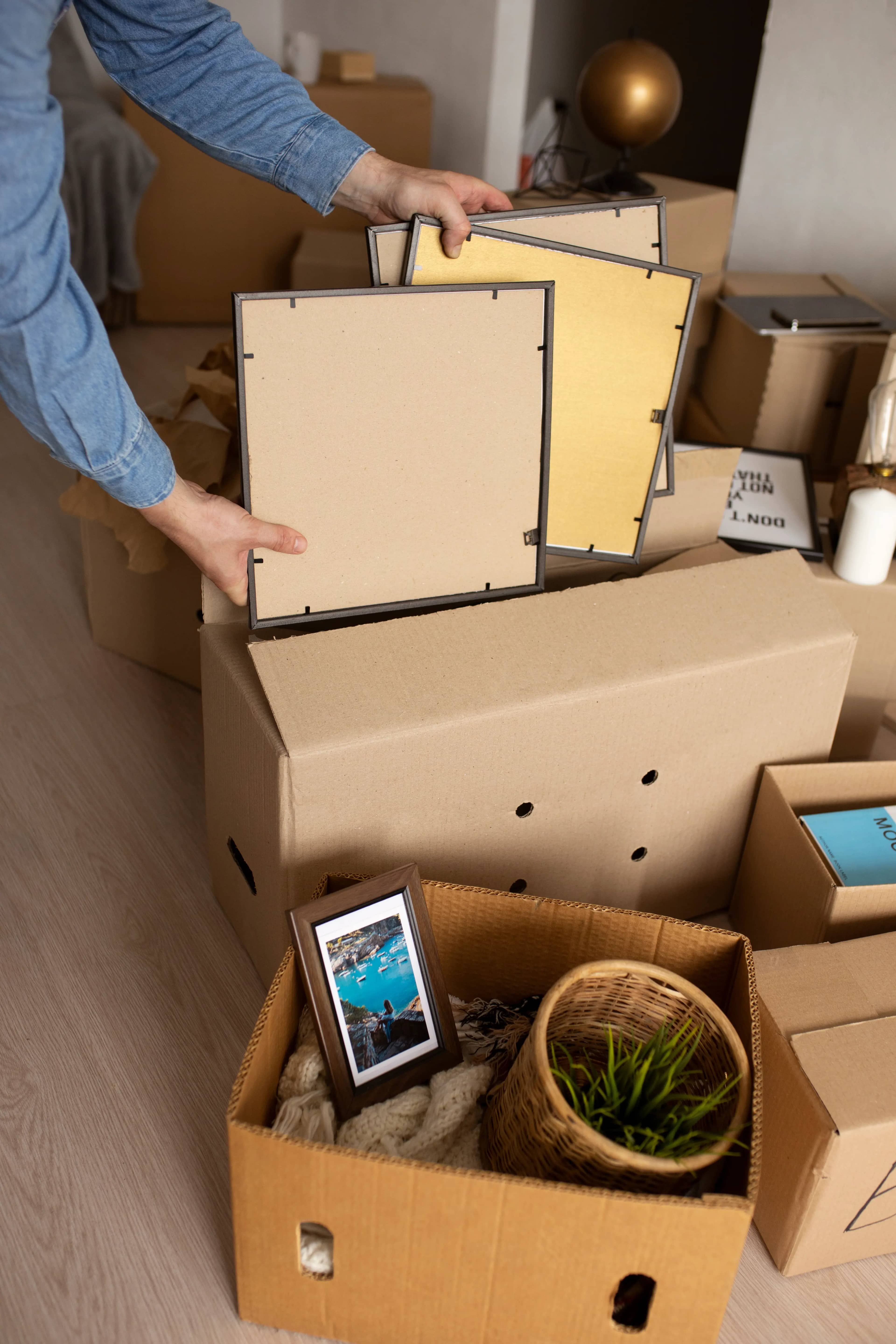 side view man packing items